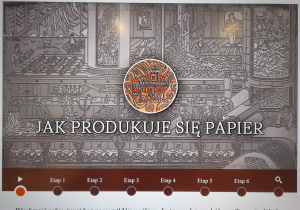 zdjęcie ekranu monitora ze slajdem z prezentacji "Jak produkuje się papier"